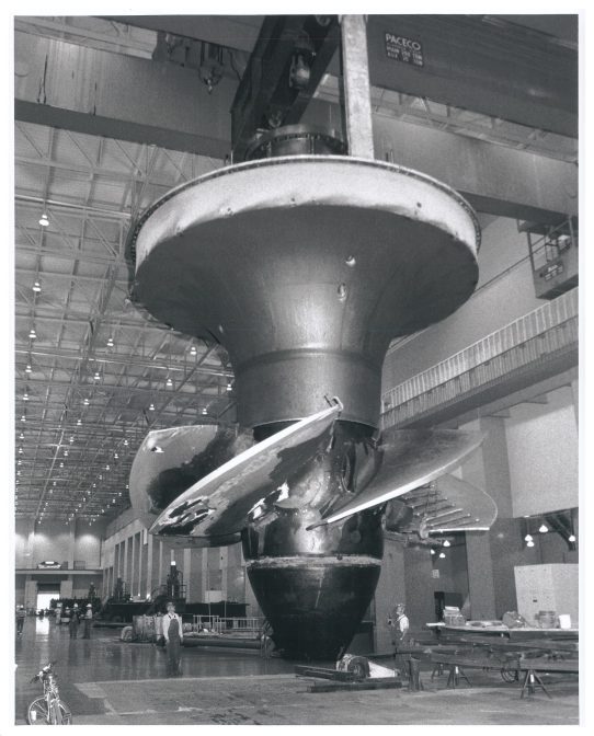 The Rocky Reach turbine runner replacement project officially began September 27th when the 370-ton turbine for Generating Unit C6 was lifted out of the hold by both powerhouse bridge cranes.